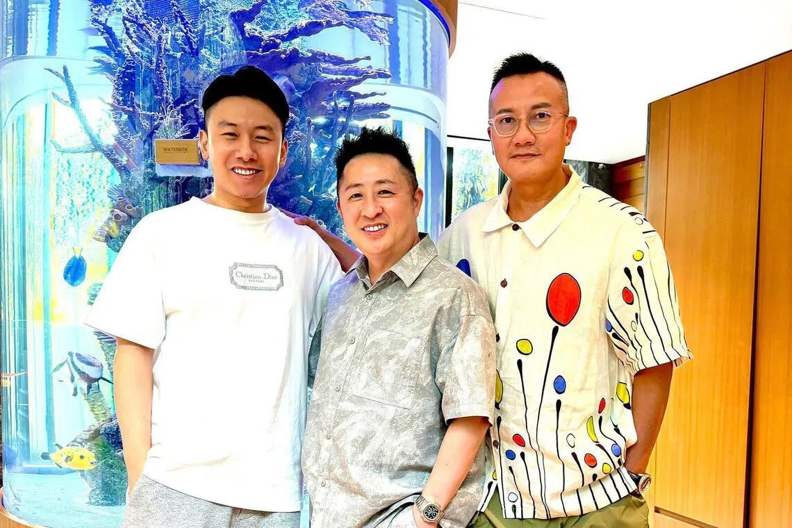 (From right) Chen Hanwei with Patrick Low and Low's son Ryan Low