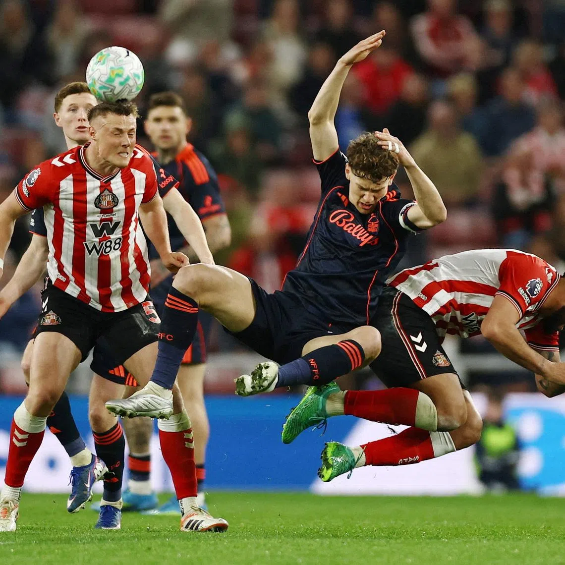Soccer Football - Premier League - Sunderland v Nottingham Forest - Stadium of Light, Sunderland, Britain - April 24, 2026 Sunderland's Daniel Ballard and Sunderland's Omar Alderete in action with Nottingham Forest's Ryan Yates Action Images via Reuters/Lee Smith