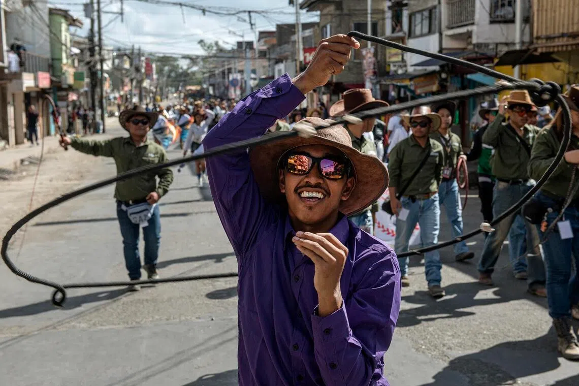 A cowboy having fun with his lasso during the opening parade on April 13, in Masbate, Philippines.