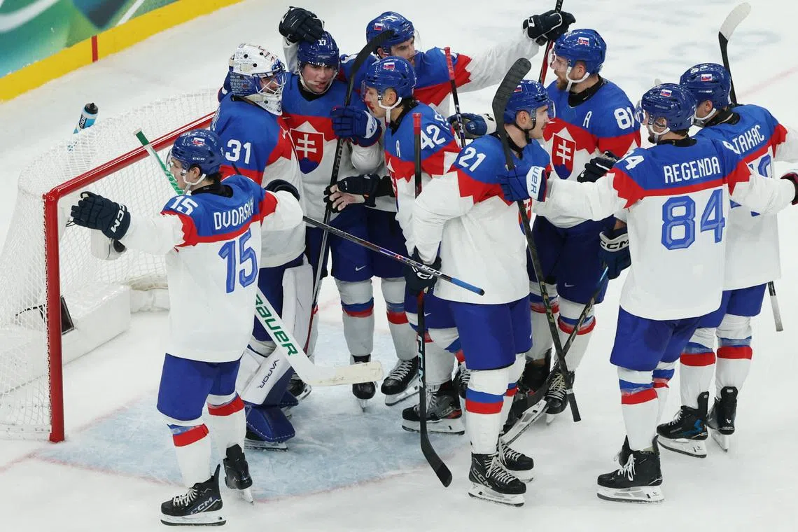 Milano Cortina 2026 Olympics - Ice Hockey - Men's Preliminary Round - Group B - Sweden vs Slovakia - Milano Santagiulia Ice Hockey Arena, Milan, Italy - February 14, 2026. Slovakia players react after the match REUTERS/Mike Segar