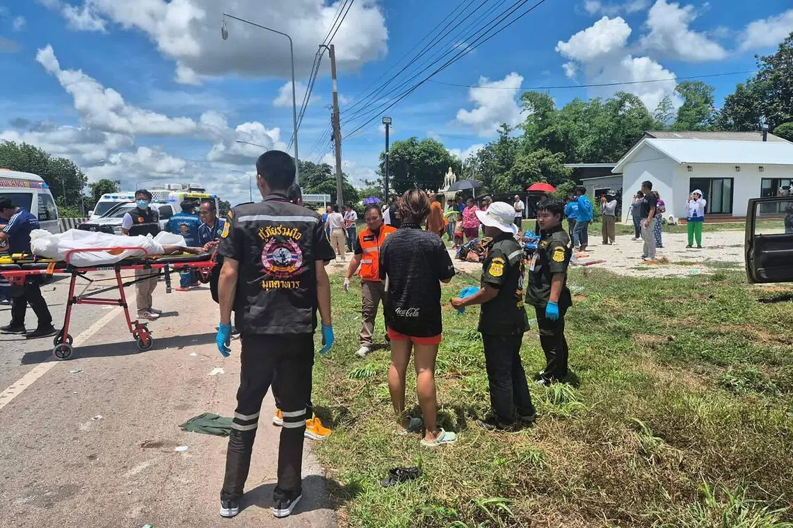 Rescue workers retrieving the body of a Buddhist monk after a collision between the monks’ roadside procession and a pickup truck driven by an 11-year old on July 2.