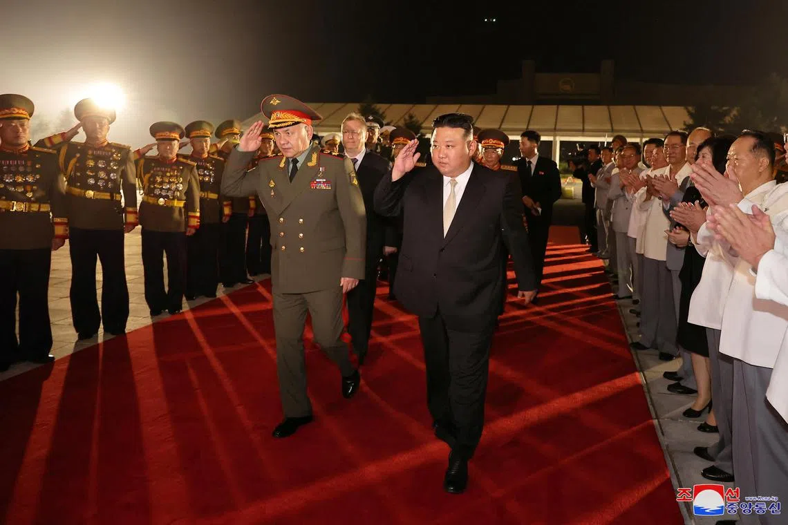 North Korean leader Kim Jong Un and Russia's Defense Minister Sergei Shoigu saluting during a visit to an exhibition of armed equipment on the occasion of the 70th anniversary of the Korean War armistice. 