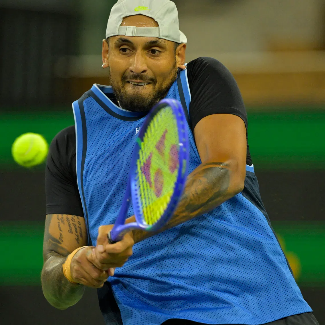 Mar 6, 2025; Indian Wells, CA, USA;  Nick Kyrgios (AUS) hits a shot against Botic Van De Zandschulp (not pictured) during his first round match of the BNP Paribas Open at the Indian Well Tennis Garden. Mandatory Credit: Jayne Kamin-Oncea-Imagn Images