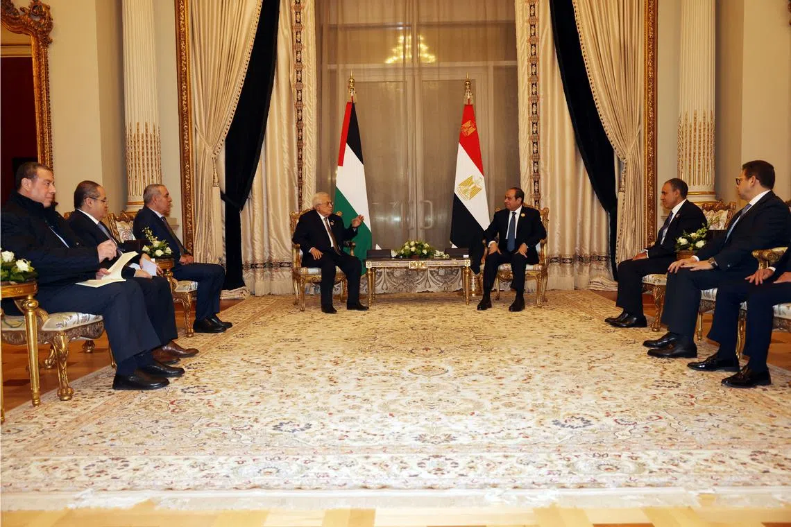 Palestinian President Mahmoud Abbas meets with the Egyptian President Abdel Fattah al-Sisi, during the emergency Arab summit organised by Egypt this week, in Cairo, Egypt March 4, 2025. Palestinian President Office/Handout via REUTERS