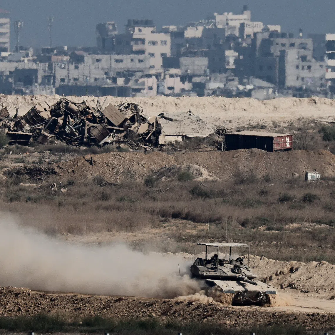 An Israeli tank manoeuvres in Gaza, as seen from the Israeli side of the border, September 28, 2025. REUTERS/Amir Cohen