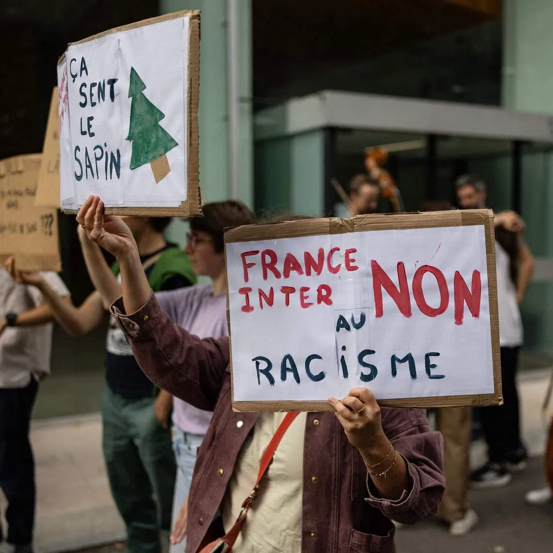 Employees of Radio France protest outside the public radio broadcaster’s headquarters with placards reading ‘France Inter, No to Racism’ against the arrival of Valeurs Actuelles deputy editor Charles Sapin as a political columnist, in Paris.