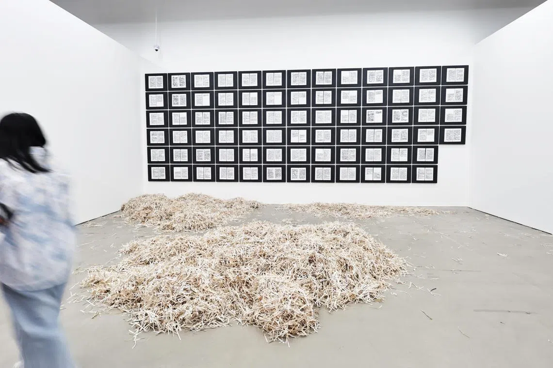 Shreded books at Heman Chong's exhibition This Is A Dynamic List And May Never Be Able To Satisfy Particular Standards For Completeness at the Singapore Art Museum. 