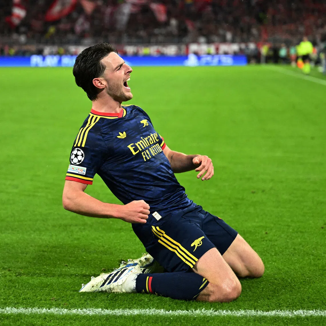 Soccer Football - UEFA Champions League - Bayern Munich v Arsenal - Allianz Arena, Munich, Germany - October 21, 2026  Arsenal's Declan Rice celebrates scoring their second goal REUTERS/Angelika Warmuth