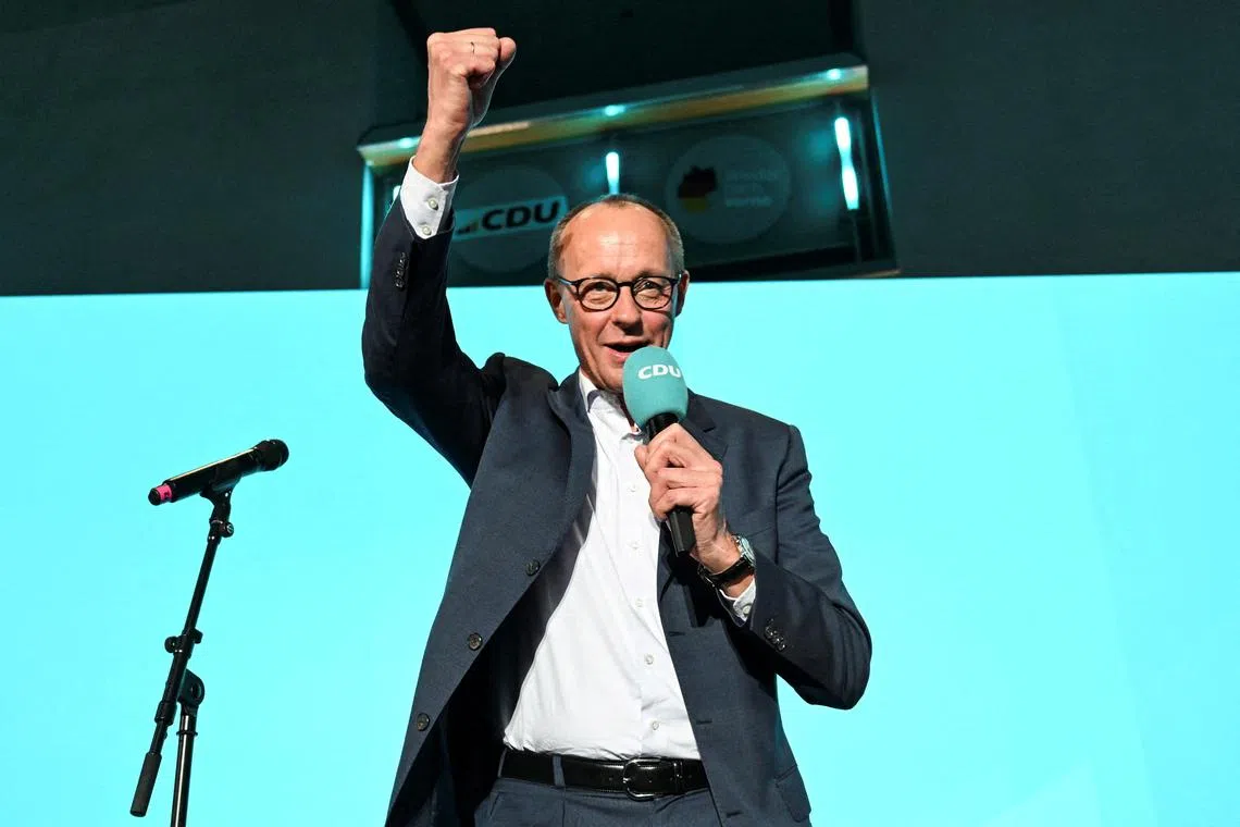 Christian Democratic Union (CDU) party leader Friedrich Merz speaks at the party headquarters, after the exit poll results are announced for the 2025 general election, in Berlin, Germany, February 23, 2025. REUTERS/Angelika Warmuth