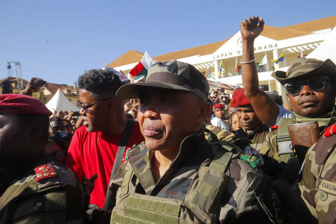 Colonel Michael Randrianirina arrives with members of the military to join protesters gathered outside the town hall on Independence Avenue during a nationwide youth-led demonstration against frequent power outages and water shortages, in Antananarivo, Madagascar, October 14, 2025. REUTERS/Zo Andrianjafy