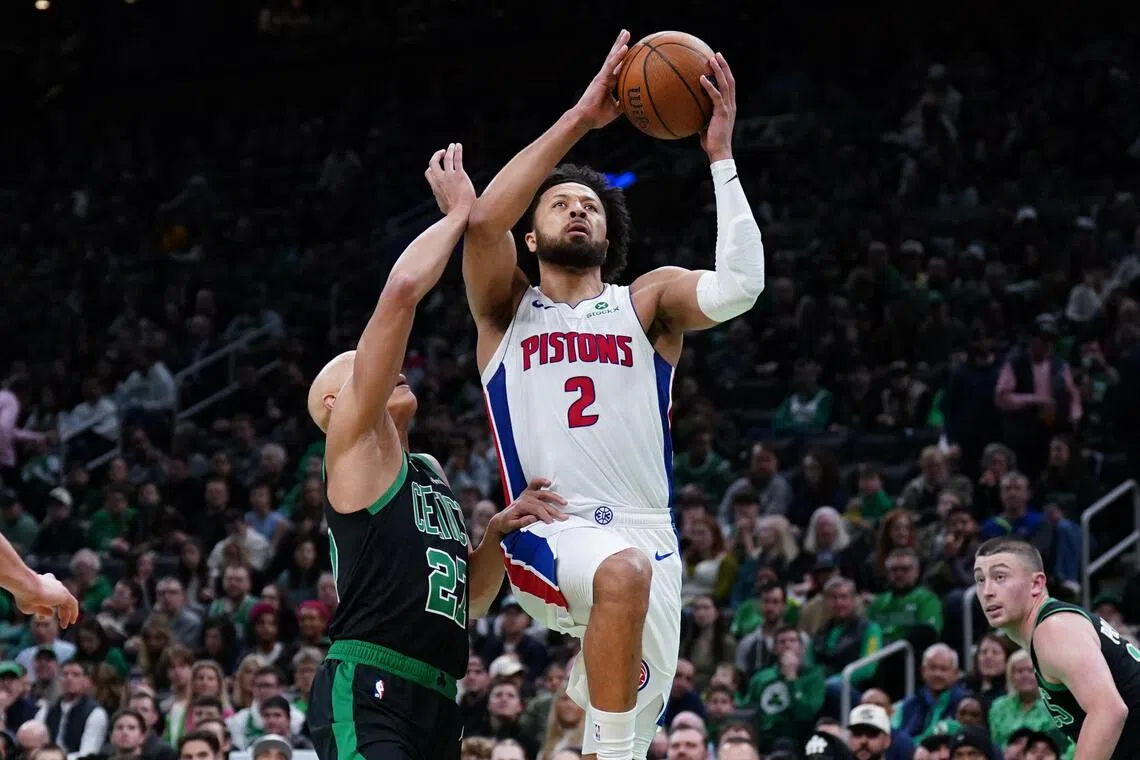 Detroit Pistons guard Cade Cunningham drives to the basket against Boston Celtics guard Jordan Walsh in the first quarter at TD Garden. 