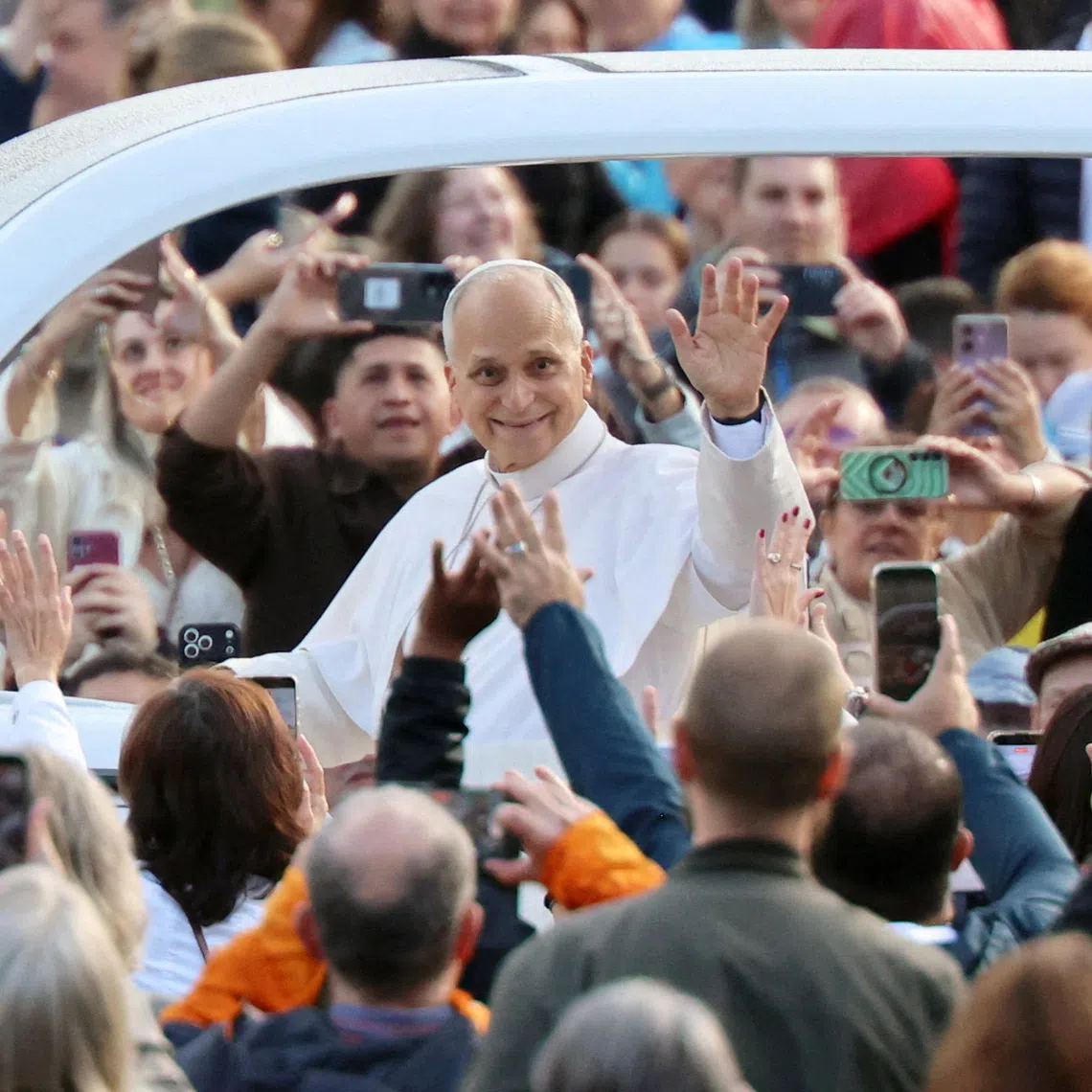 Pope Leo greeting members of the faithful in St Peter’s Square on Oct 21, as he arrives to hold his first weekly general audience since cancer surgery.