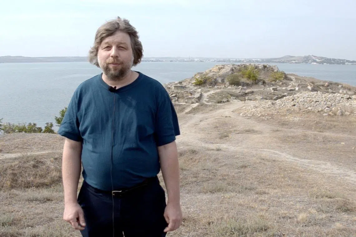 FILE PHOTO: Alexander Butyagin, a Russian archaeologist and head of the Mirmeki Expedition of the State Hermitage, speaks during the filming of a scientific and educational documentary about Mirmekion, an ancient Greek settlement located in modern-day Kerch, Crimea, in this still image from a video released in January 2021. Eastern-Crimean Historical and Cultural Museum-Preserve/Handout via REUTERS