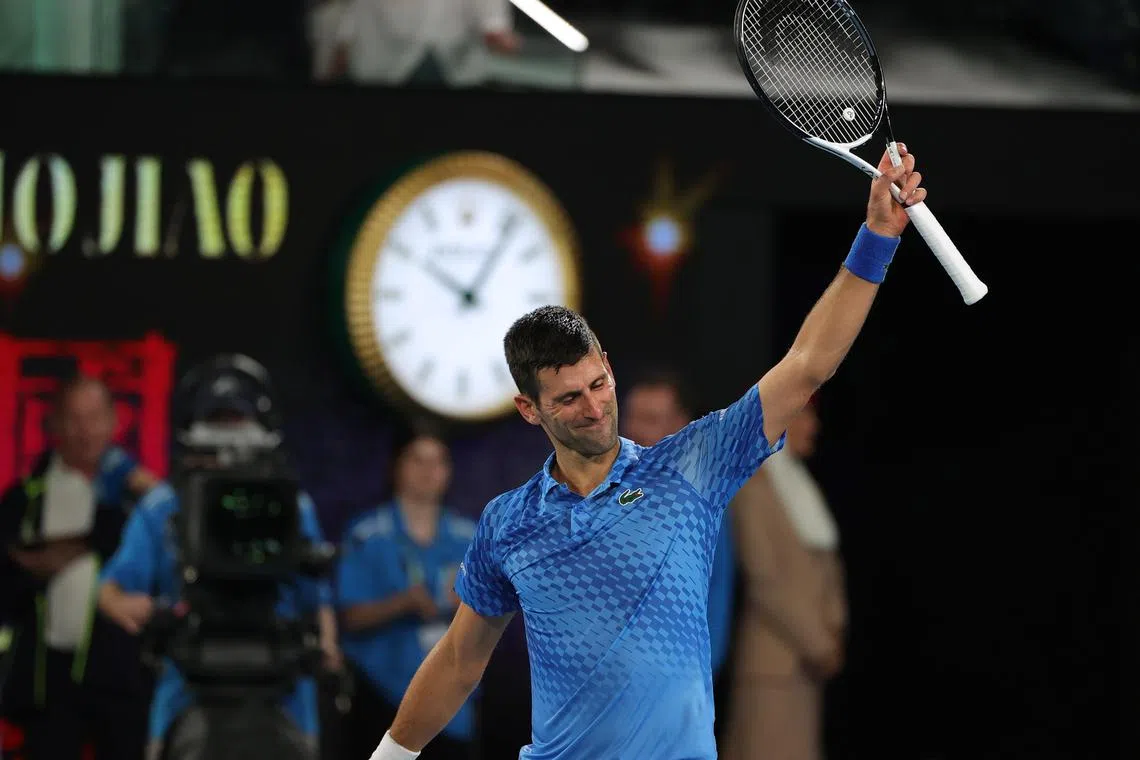 Novak Djokovic celebrates after winning his Australian Open semi-final against Tommy Paul.