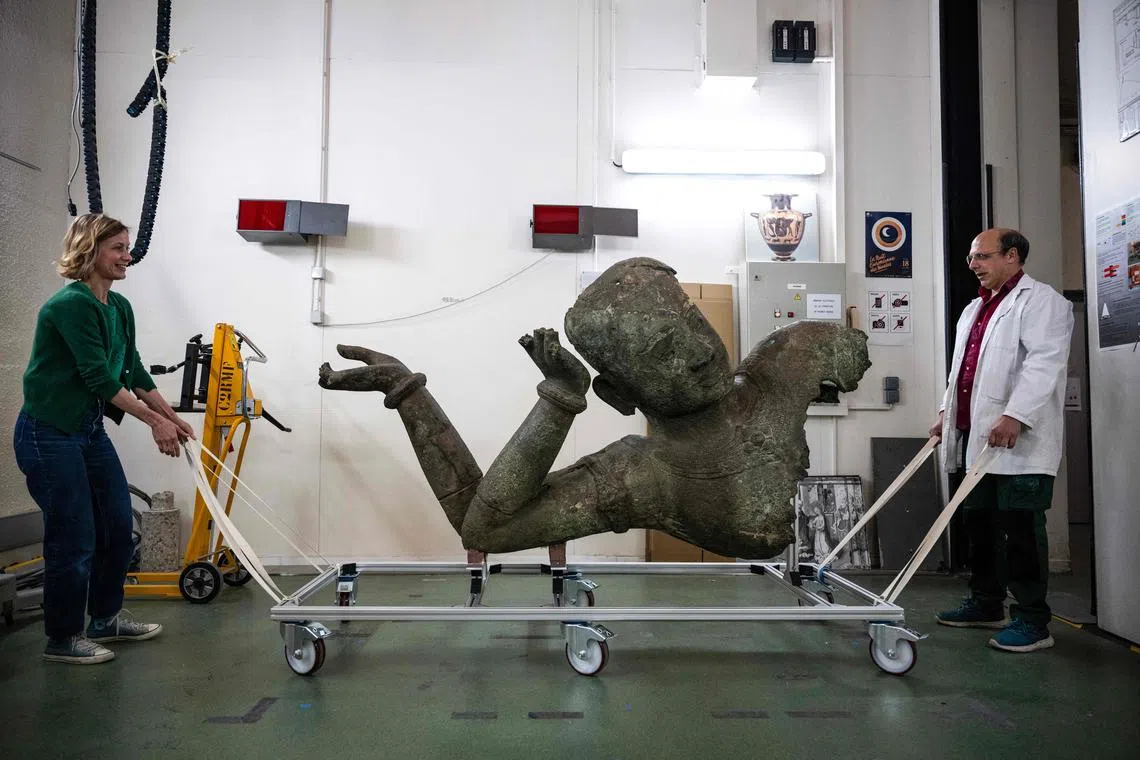 A 11th-century bronze statue of Vishnu, recently arrived from Cambodia, about to be restored at the C2RM.