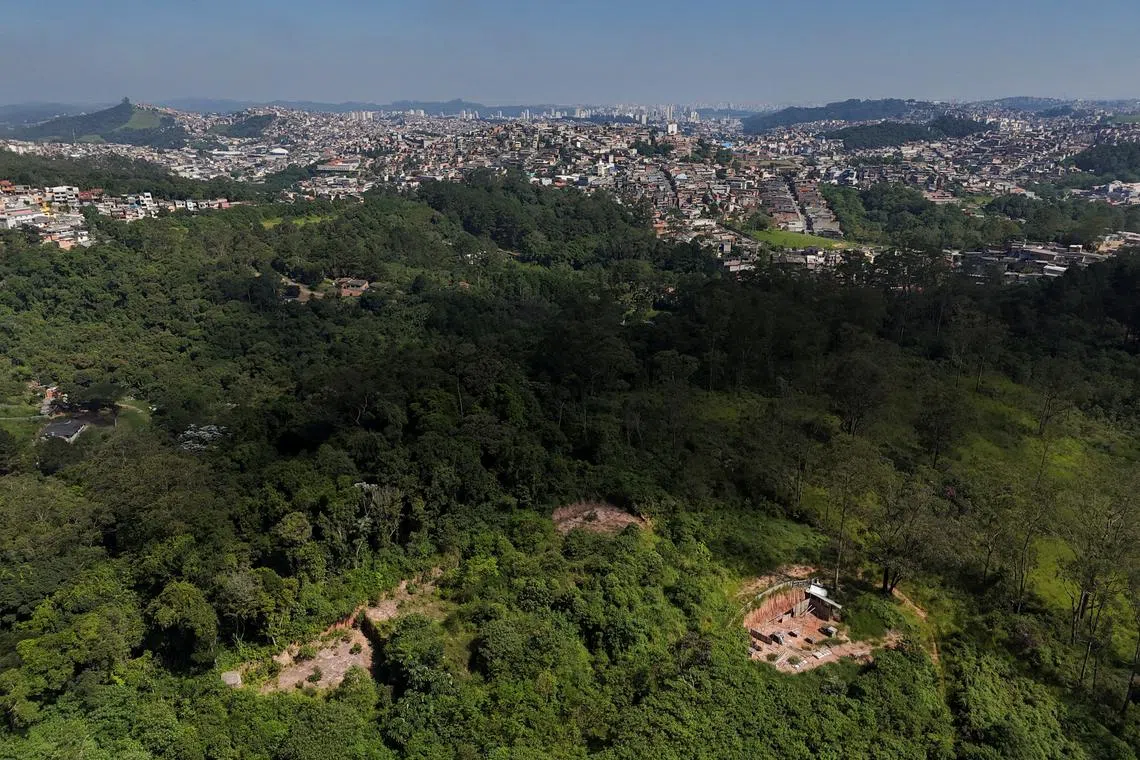 FILE PHOTO: A drone view shows the city and an area under permanent protection that was illegally deforested, in Maua, on the outskirts of Sao Paulo, Brazil, April 21, 2024. REUTERS/Amanda Perobelli/File Photo