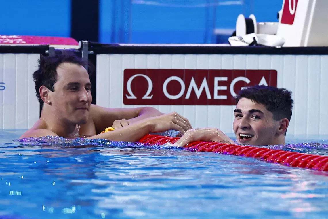 Portugal's Diogo Matos Ribeiro (left) reacting after winning the men's 50m butterfly with Australia's third-placed Cameron McEvoy.