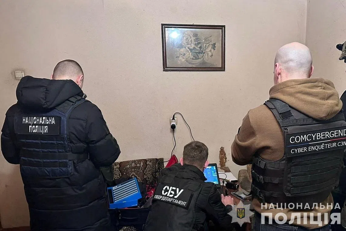 FILE PHOTO: Cybersecurity specialists from Ukraine's Security Service work at an unknown location in Ukraine, in this undated handout released February 21, 2024. State Security Service of Ukraine/Handout via REUTERS/File Photo