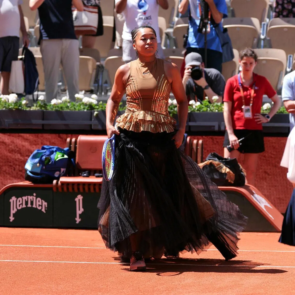 Japan's Naomi Osaka arriving on Court Suzanne-Lenglen ahead over her 6-3, 7-6 (7-3) win against Germany's Laura Siegemund on Day 3 of the French Open tennis tournament at Roland Garros in Paris on May 26, 2026. 
