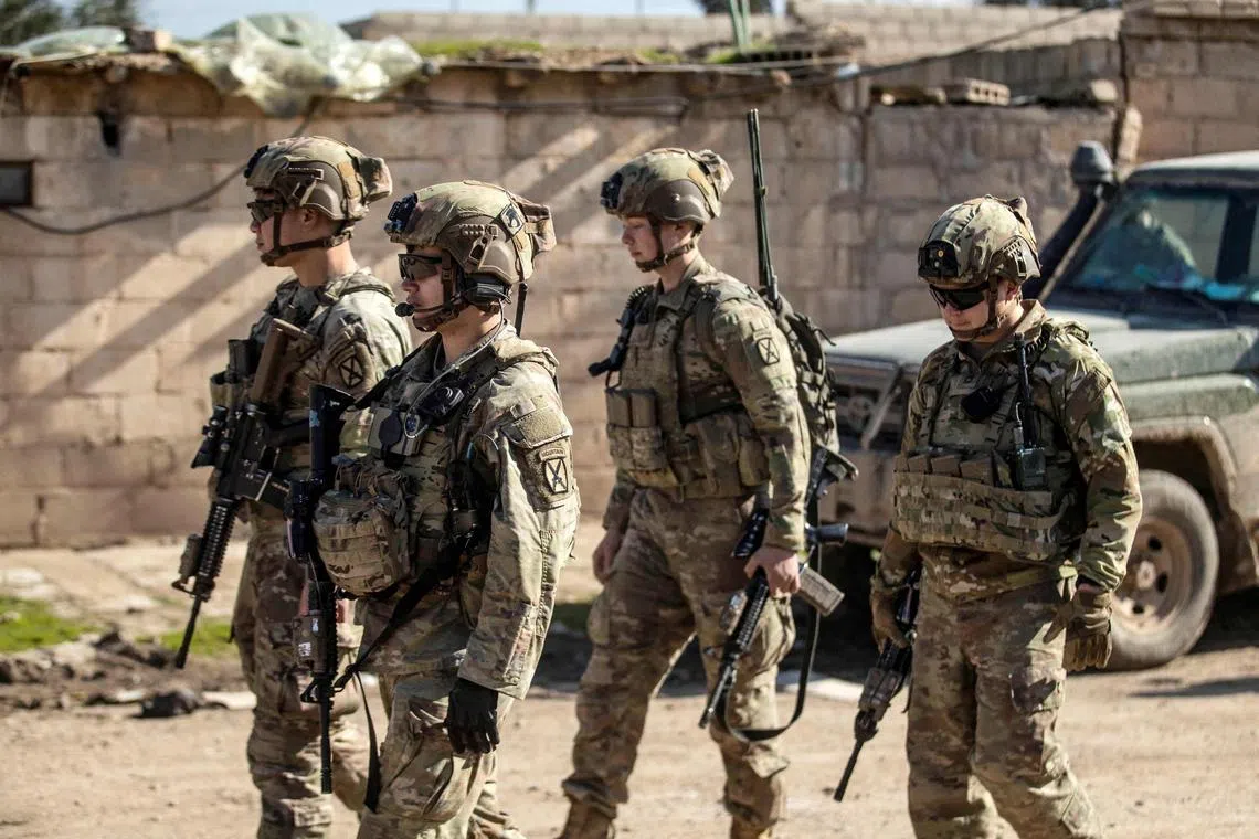 US soldiers patrol an area in the town of Tal Hamis, in Syria.