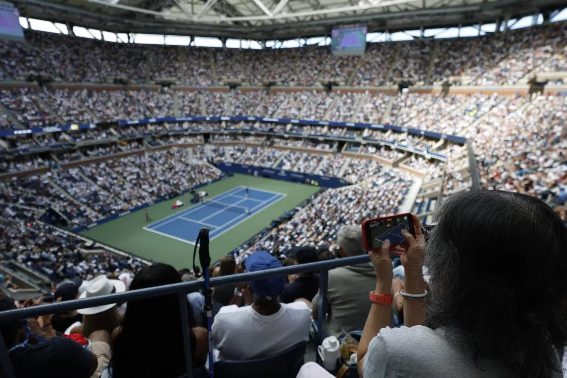FILE PHOTO: Sep 2, 2025; Flushing, NY, USA; A fan takes a video during the match between Carlos Alcaraz (ESP) (L) and Jiri Lehecka (CZE) (R) on day ten of the 2025 US Open tennis championships at Billie Jean King National Tennis Center. Mandatory Credit: Geoff Burke-Imagn Images/ File Photo