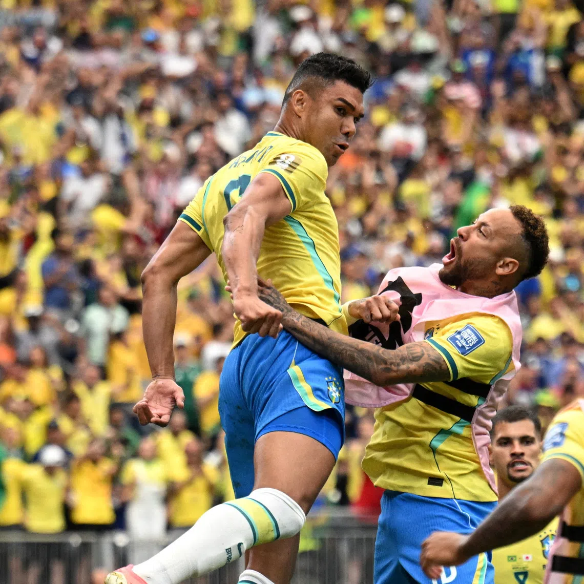 Brazil’s Casemiro celebrates with Neymar after scoring against Japan at the World Cup.