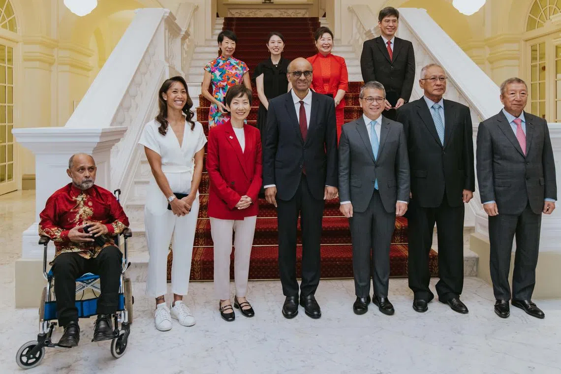 President Tharman Shanmugaratnam (front row, centre), flanked by Minister for Sustainability and the Environment Grace Fu and Minister for Culture, Community and Youth Edwin Tong, at a ceremony for the Singapore Sport Hall of Fame inductees at the Istana on Feb 6.