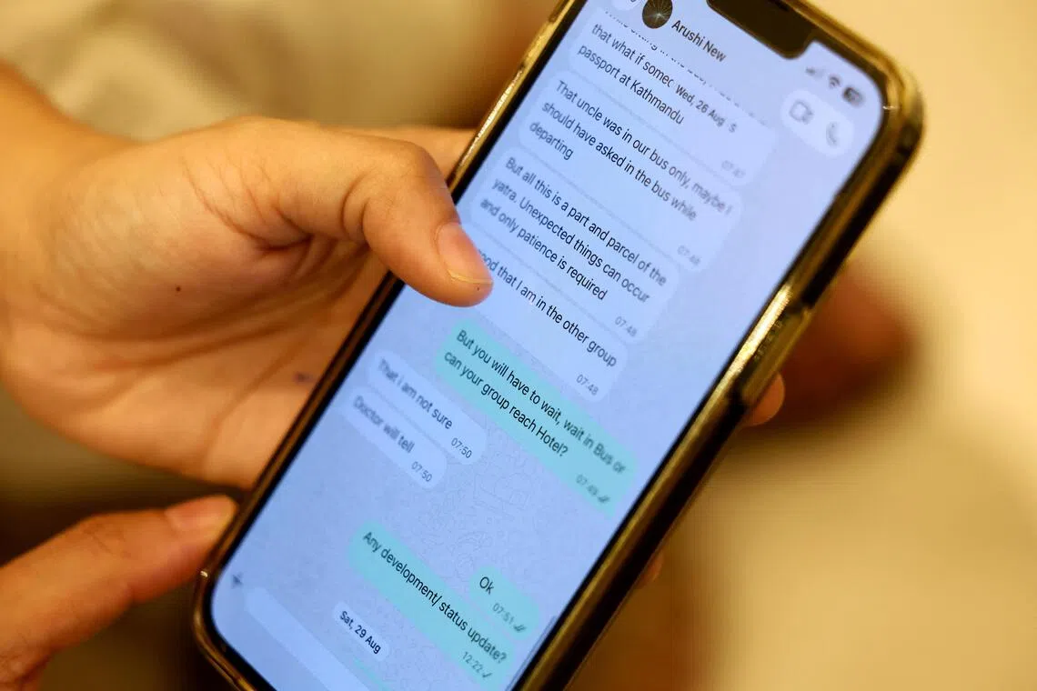 Ajay Gupta, father of Arushi Gupta, shows a WhatsApp conversation with his daughter in New Delhi on Sept 10.