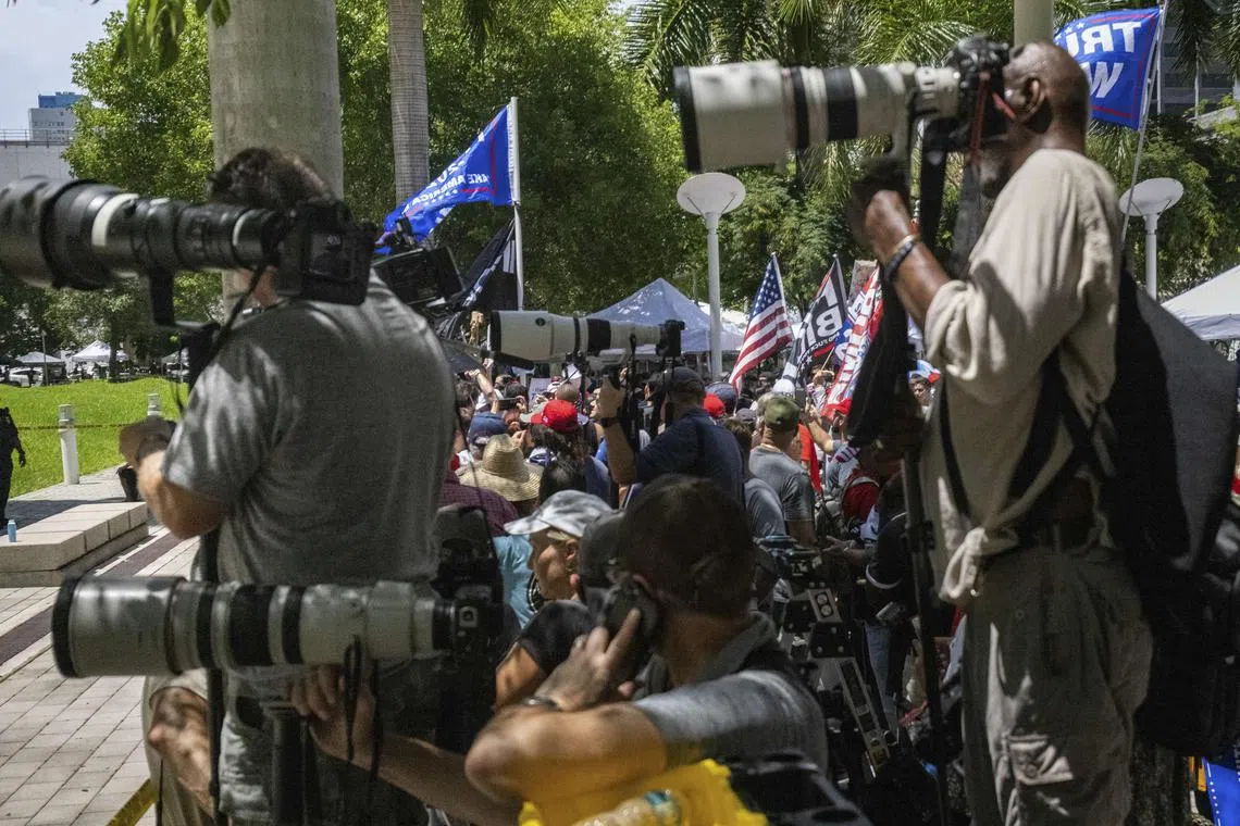 Photojournalists and supporters of  Trump outside the Wilkie D. Ferguson Jr. U.S. Courthouse as Trump arrives in Miami.