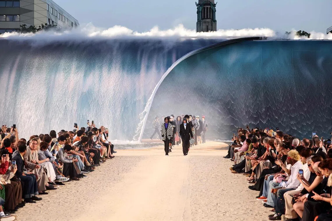 The 8m high wave formed the backdrop to singer-songwriter Pharrell Williams’ 2027 spring-summer show.