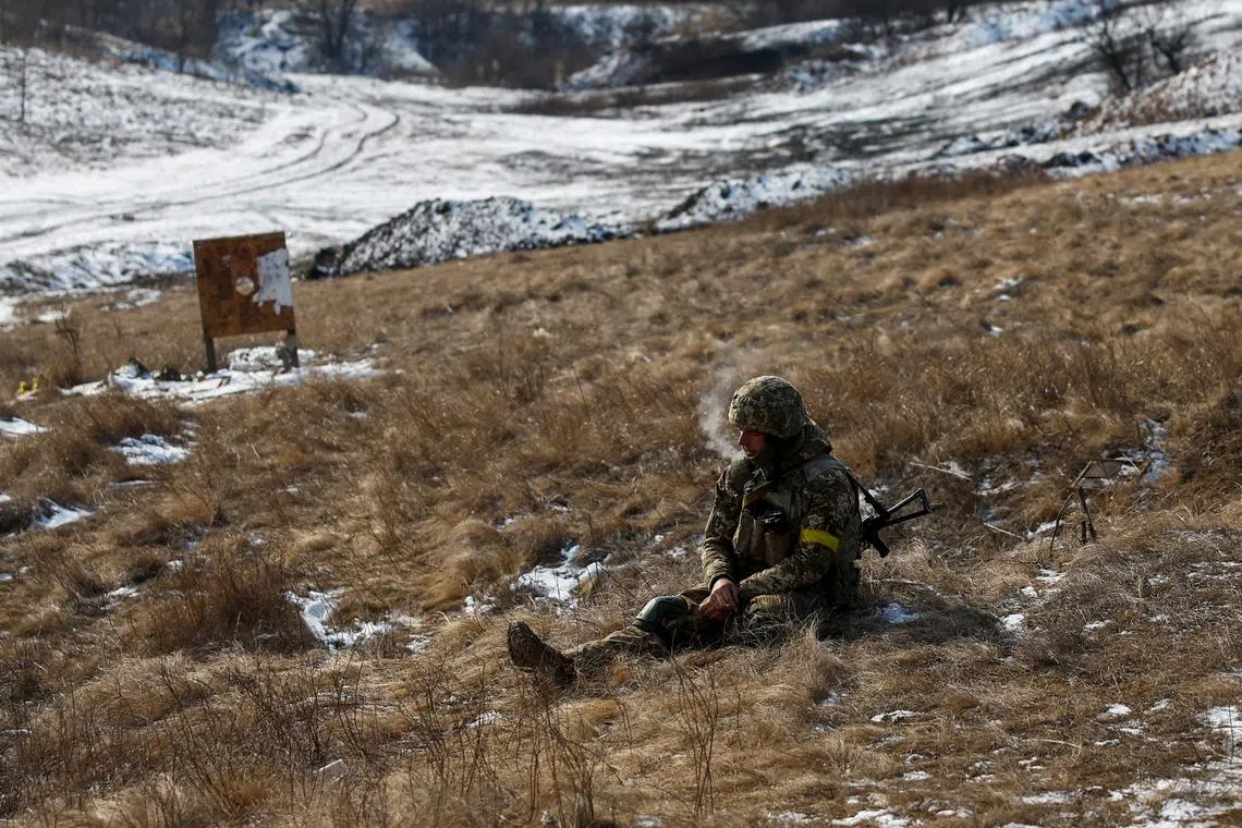 A Ukrainian serviceman of the 88th Separate Marine Battalion of the 35th Separate Marine Brigade rests between military exercises at a training ground, amid Russia's attack on Ukraine, in Dnipropetrovsk region, Ukraine February 24, 2025. REUTERS/Valentyn Ogirenko