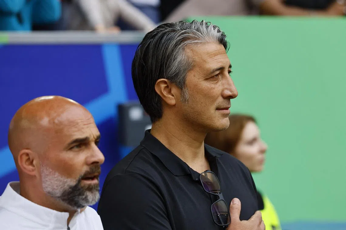 Soccer Football - Euro 2024 - Quarter Final - England v Switzerland - Dusseldorf Arena, Dusseldorf, Germany - July 6, 2024 Switzerland coach Murat Yakin during the national anthems before the match REUTERS/Wolfgang Rattay