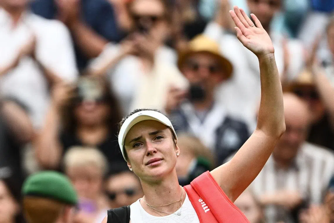 Ukraine's Elina Svitolina waves to the public as she leaves the court after losing the match to Marketa Vondrousova.