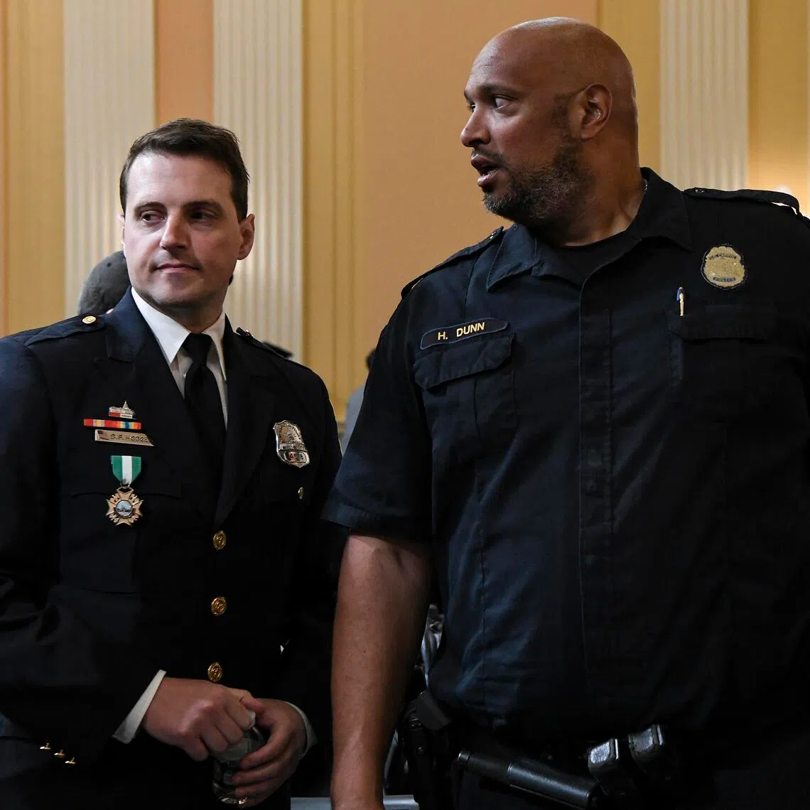 A 2022 photo showing police officers  Daniel Hodges (left) and Harry Dunn.