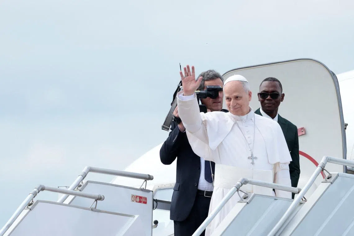 Pope Leo XIV waves as he boards a plane bound for Bamenda where he will attend a meeting for peace and hold a holy Mass, at Yaounde Nsimalen International Airport, in Yaounde, Cameroon, April 16, 2026. REUTERS/Luc Gnago