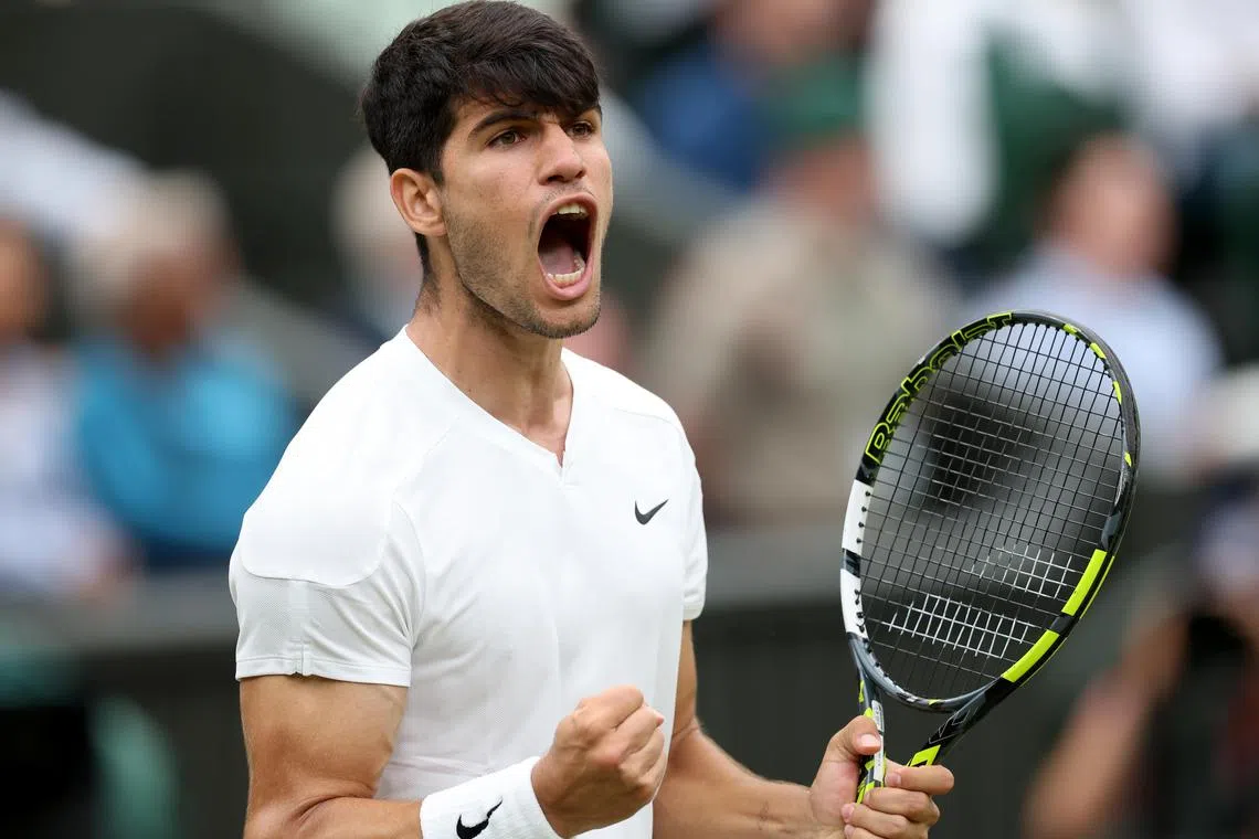 Carlos Alcaraz of Spain celebrating a point during his match against Frances Tiafoe at Wimbledon.