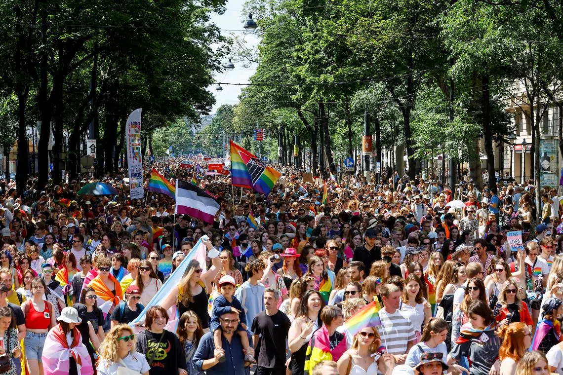 People celebrate during the annual Rainbow Parade, a Pride parade to support the rights of lesbian, gay, bisexual, transgender, intersex and queer (LGBTIQ) people in Vienna, Austria June 11, 2022. REUTERS/Lisa Leutner/ File Photo