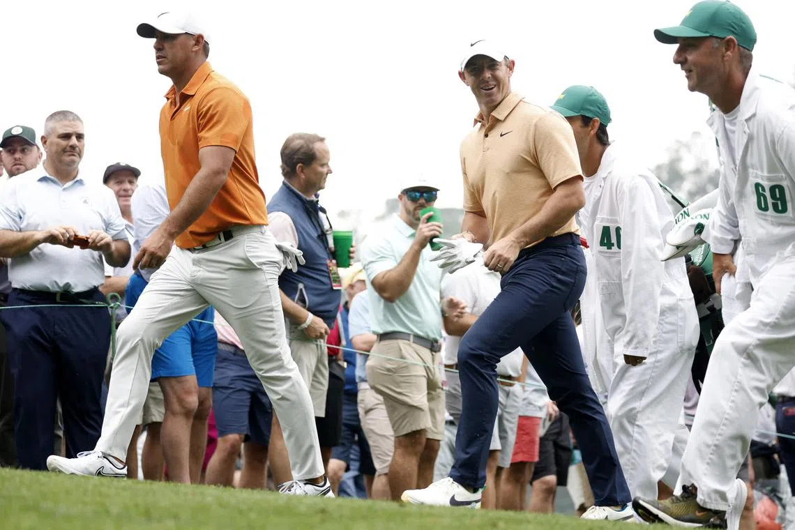 Golf - The Masters - Augusta National Golf Club - Augusta, Georgia, U.S. - April 4, 2023
Northern Ireland's Rory McIlroy and Brooks Koepka of the U.S. walk to the 4th during a practice round REUTERS/Jonathan Ernst