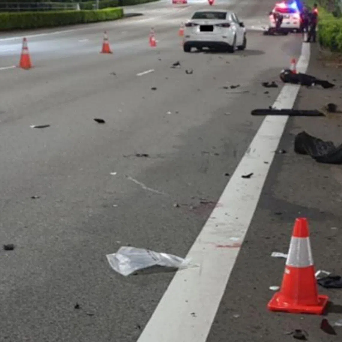 A 20-year-old motorcyclist died after a collision with the man's vehicle, which was left stationary in the middle of an expressway.