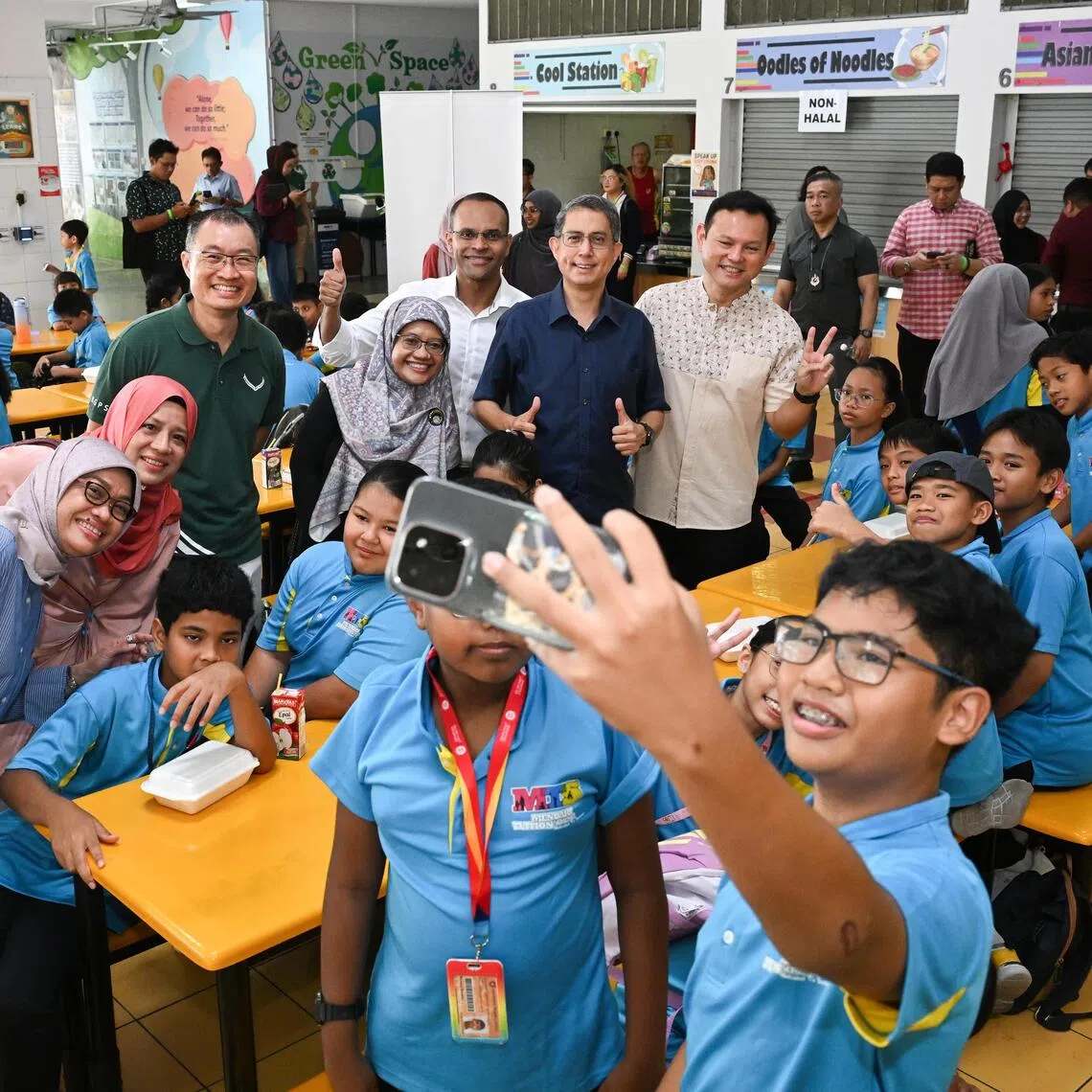 Mendaki chairman Zaqy Mohamad (right) and Acting Minister-in-charge of Muslim Affairs Faishal Ibrahim (second from right) visiting Mendaki tuition classes at Bedok Green Primary School on Sept 27. Also present are Yayasan Mendaki chief executive Zuraidah Abdullah (far left) and Mr Mohamed Feroz Mohamed Akber (third from right), who will be appointed as the chief executive officer-designate of Yayasan Mendaki on Oct 1.
