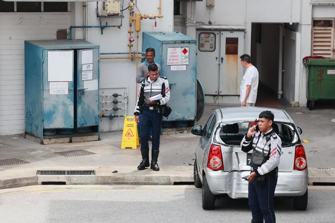 Police officers at the scene of the car accident in Bishan in 2023. Loh Chun Meng was sentenced to two weeks’ jail, fined $2,000 and banned from driving for two years.