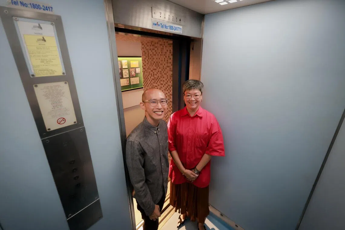 National Museum of Singapore director Chung May Khuen (right) and Singapore History Gallery’s principal curator Daniel Tham in a restored 1970s Ang Mo Kio lift.