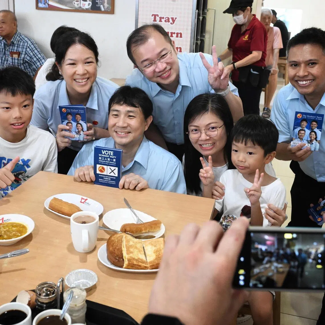 From left: WP candidates for Sengkang GRC He Ting Ru, Jamus Lim, Louis Chua and Abdul Muhaimin Abdul Malik, meets residents during a walkabout at Rivervale Plaza on April 27, 2025.