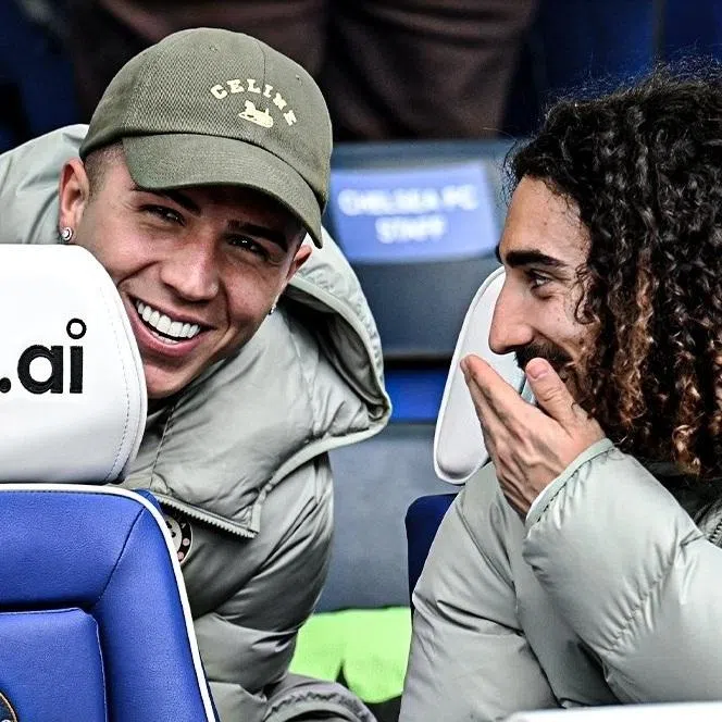 Chelsea's Enzo Fernandez (left) in the stands with teammate Marc Cucurella after he was banned for two matches by manager Liam Rosenior. Fernandez had hinted he was willing to leave Stamford Bridge at the end of the season.
