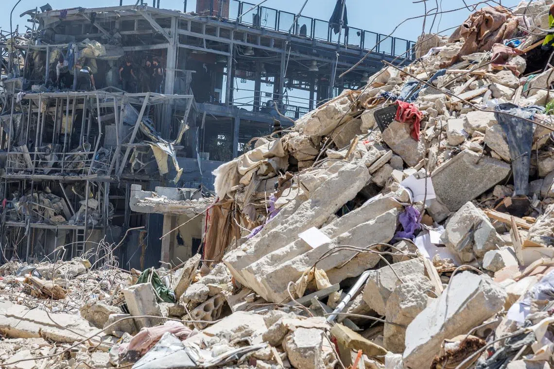 Workers clean a restaurant that was damaged by an Israeli strike, amid a temporary ceasefire between Lebanon and Israel, in Tyre, Lebanon, on April 23.