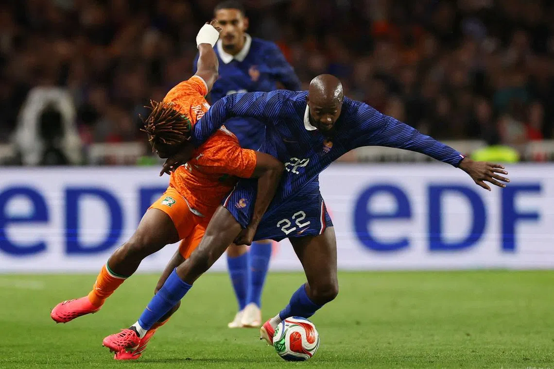 Soccer Football - International Friendly - France v Ivory Coast - The Stade de la Beaujoire - Louis Fonteneau, Nantes, France - June 4, 2026 France's Jean Philippe Mateta in action with Ivory Coast's Emmanuel Agbadou REUTERS/Gonzalo Fuentes