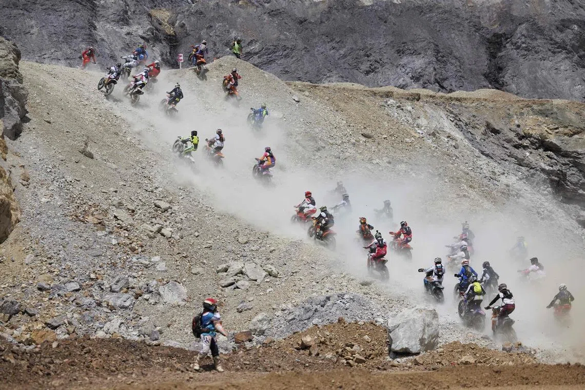 Competitors starting the race on their motorbikes, on June 7, 2026, during the Red Bull Hare Scramble event as part of the Erzbergrodeo on the Erzberg in Eisenerz, Austria.
