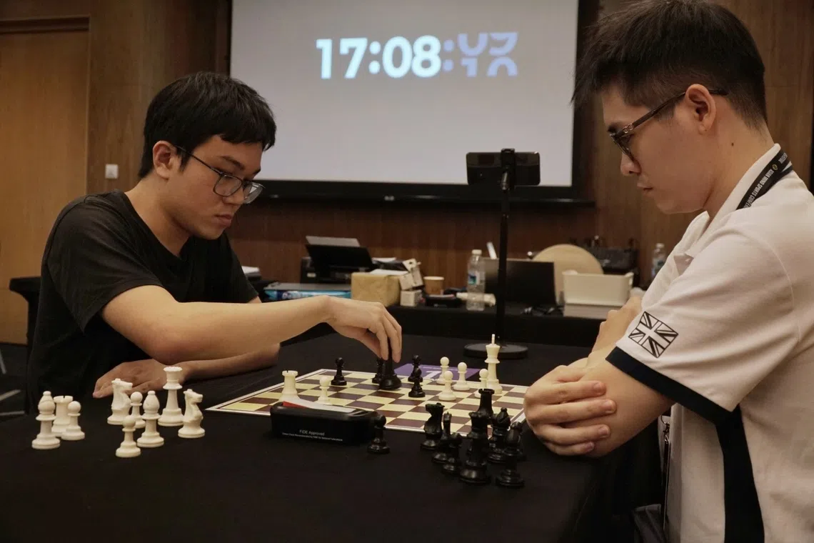 Singapore chess player Tin Jingyao (left) coming up against Vietnam's Le Tuan Minh at the Asian Mind Sports Conference and Festival on Nov 15, 2025.