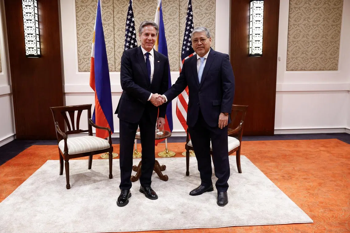 U.S. Secretary of State Antony Blinken shakes hands with Philippines' Secretary of Foreign Affairs Enrique Manalo, at the Sofitel Hotel in Manila, Philippines, March 19, 2024. REUTERS/Evelyn Hockstein/Pool