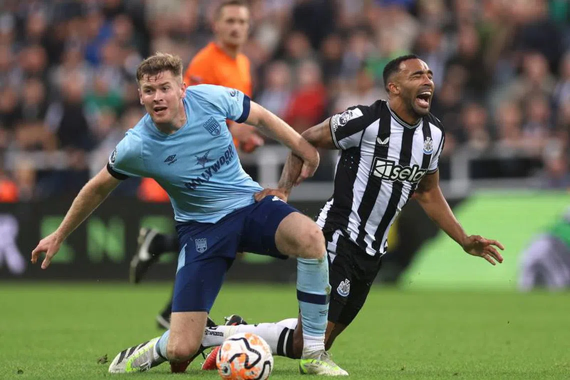 Soccer Football - Premier League - Newcastle United v Brentford - St James' Park, Newcastle, Britain - September 16, 2023 Brentford's Nathan Collins in action with Newcastle United's Callum Wilson Action Images via Reuters/Lee Smith